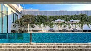 Outdoor pool, pool umbrellas, pool loungers