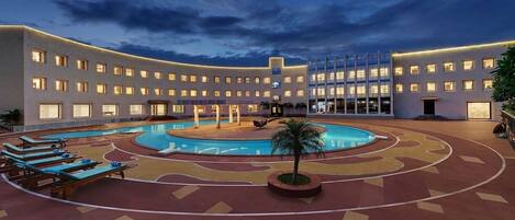 2 outdoor pools, open 7:00 AM to 7:00 PM, pool umbrellas