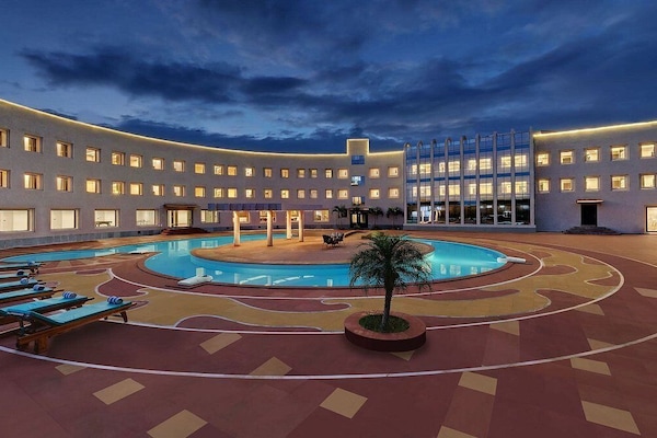 2 outdoor pools, open 7:00 AM to 7:00 PM, pool umbrellas