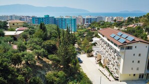 A residential area with a mix of apartment buildings, some with solar panels on the roofs. - Monte Mare Hotel (Vlorë)