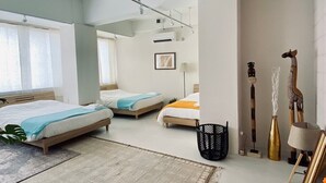 A spacious bedroom with two beds, a large window, and a modern ceiling design. - Lestel Naha - Hostel (Naha)