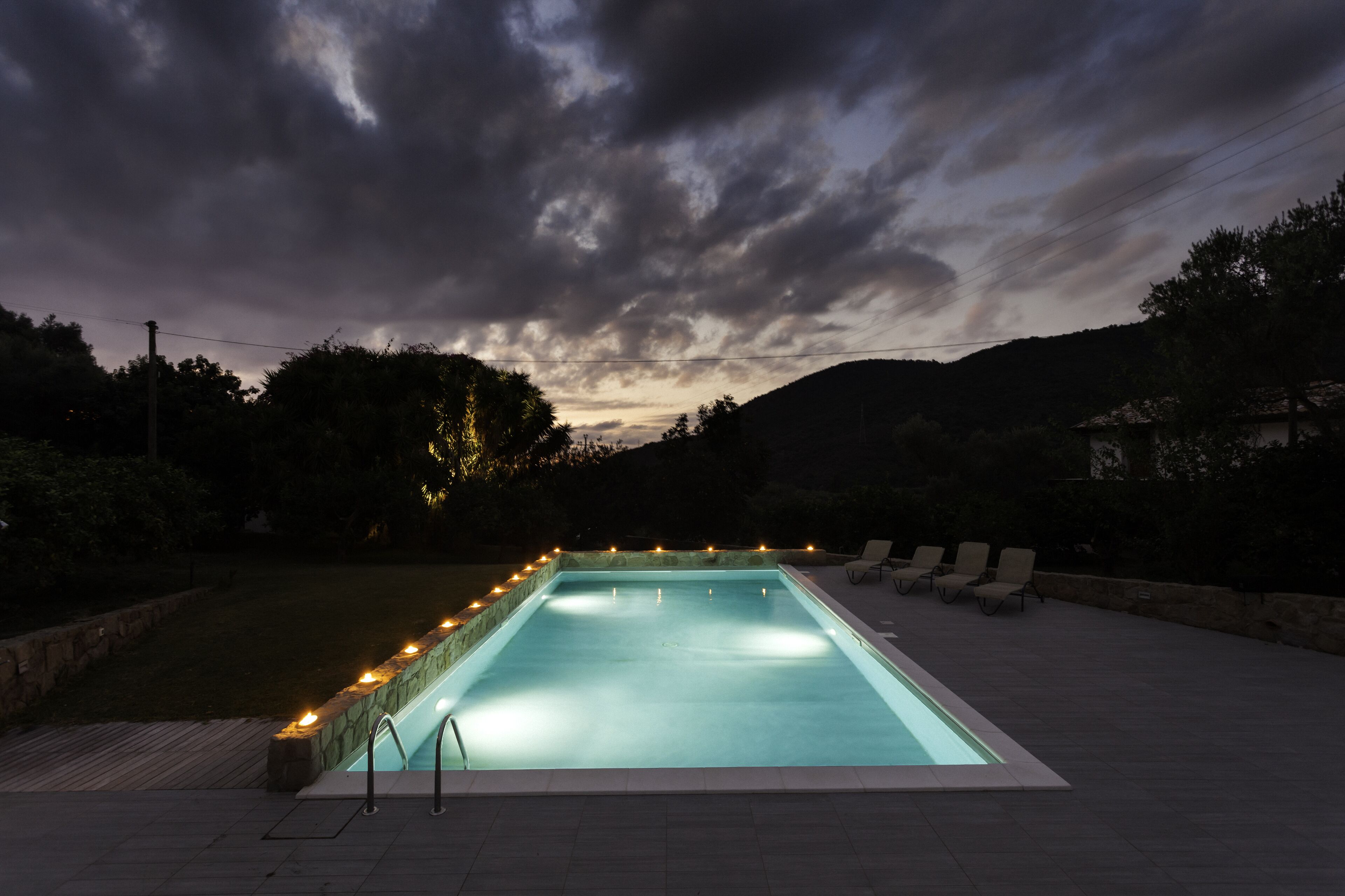 Seasonal outdoor pool, a rooftop pool, pool umbrellas, pool loungers