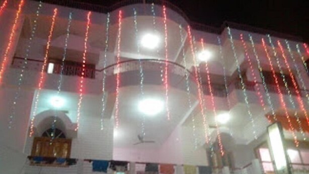 A building with a sign reading "SHANTI GUEST HOUSE." - Hotel Shanti (Gaya)