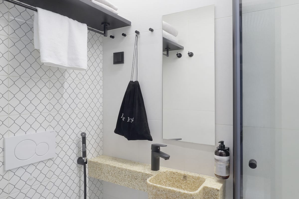 shower, hair dryer, bidet, towels