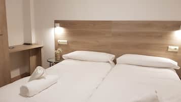 Superior Twin kamer | Donzen dekbedden, extra bedden, gratis wifi, beddengoed