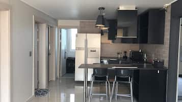 Terraced resort pension with outdoor garden | Private kitchen | Full-size fridge, microwave, coffee/tea maker, electric kettle
