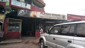 A building with a sign for 'Plateau Breeze' accommodation. - The Plateau Breeze Hotel (Ruiru)