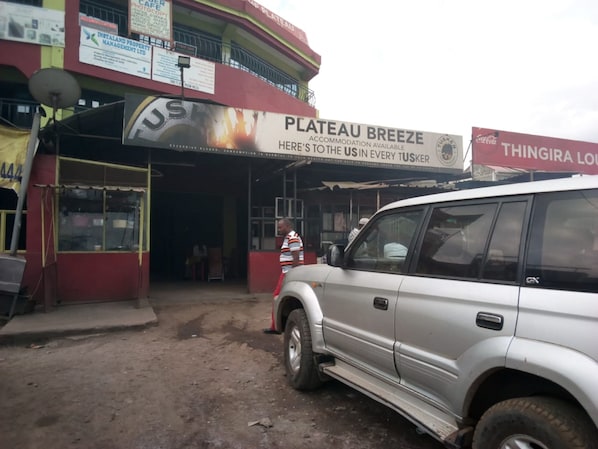A building with a sign for 'Plateau Breeze' accommodation. - The Plateau Breeze Hotel (Ruiru)