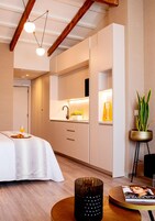 Studio (Pret a Porter) | Desk, blackout drapes, soundproofing, iron/ironing board