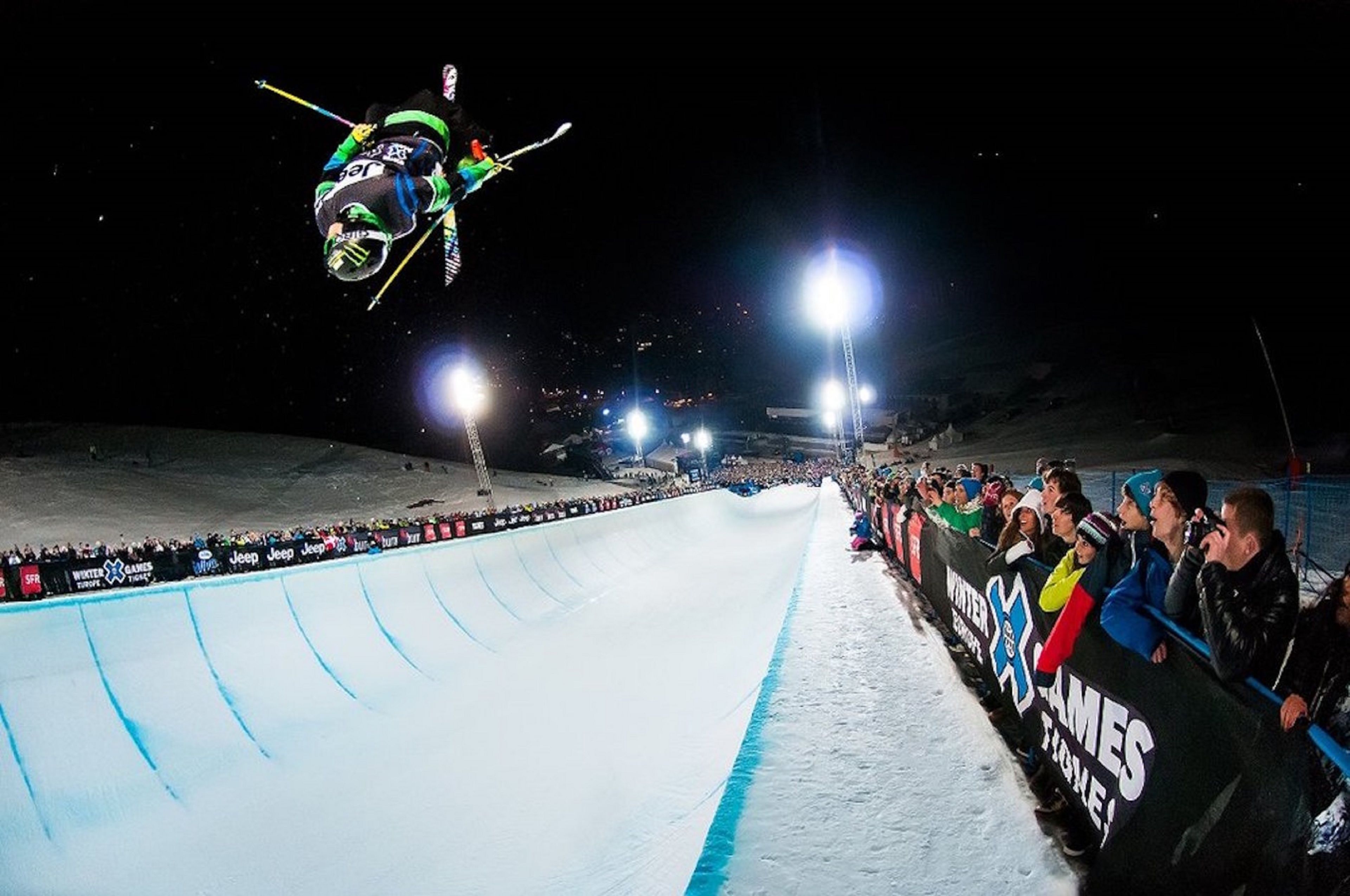 A ski jump with a ramp and spectators.