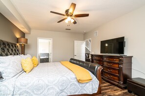 A bedroom with a bed, a ceiling fan, a dresser, and a TV. - Private Pool Home With Fantastic Upgrades. Very Safe for Children! - 5av534 (Davenport)