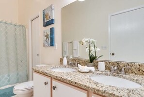 Separate bathtub and shower, towels
