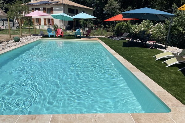 Seasonal outdoor pool, open 10:00 AM to 8:00 PM, pool umbrellas