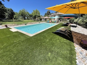Seasonal outdoor pool, open 10:00 AM to 8:00 PM, pool umbrellas