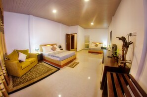 Superior Triple Room | Minibar, in-room safe, desk, iron/ironing board