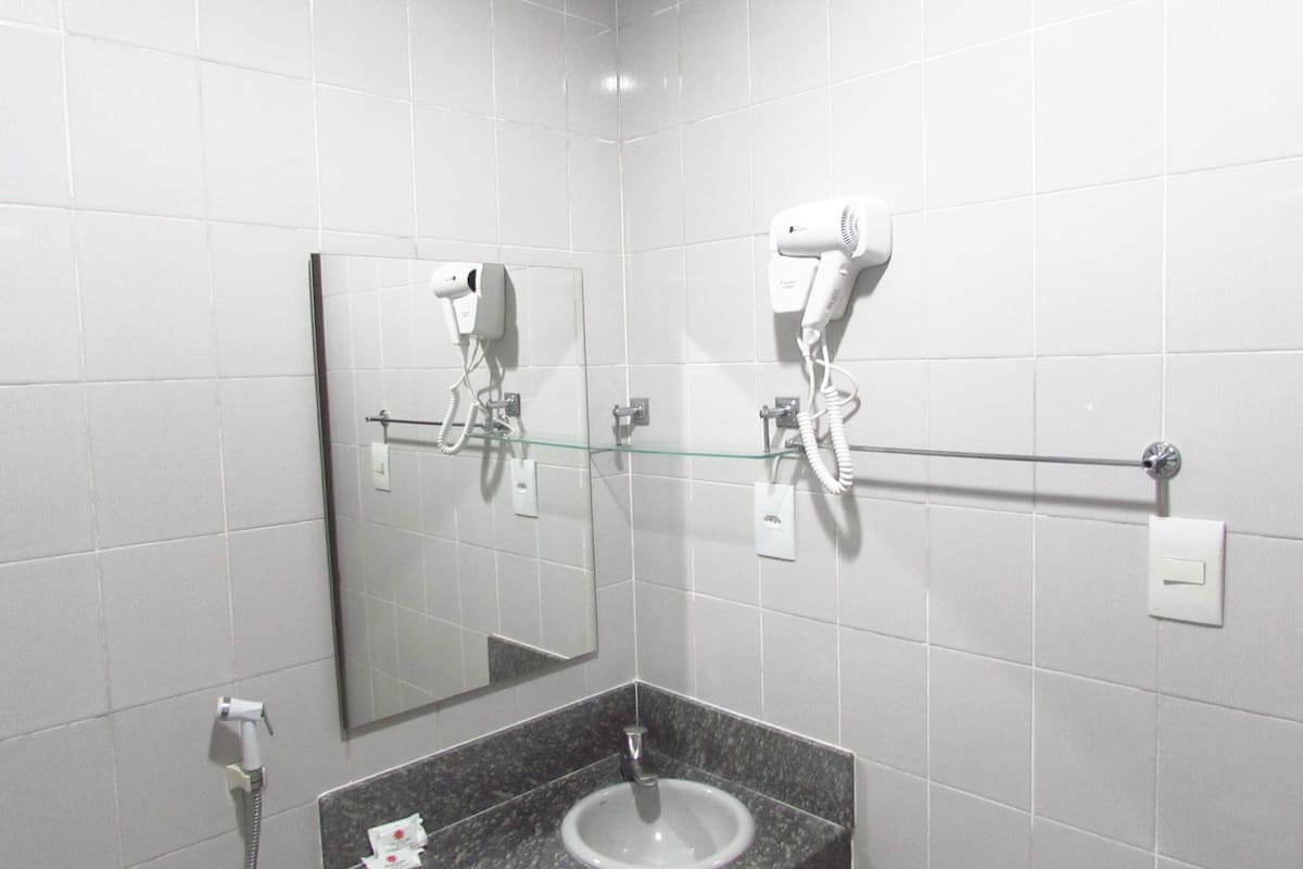 standard room | bathroom | shower, hair dryer, towels, toilet paper