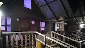 A multi-level building with a staircase and a balcony. - Cabanas Islas de Tziscao (La Trinitaria)