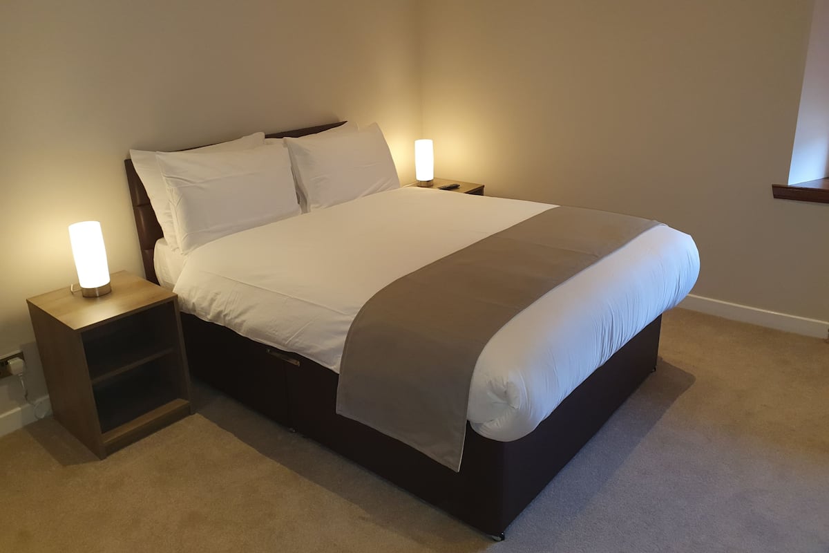 Premium bedding, blackout curtains, soundproofing, iron/ironing board