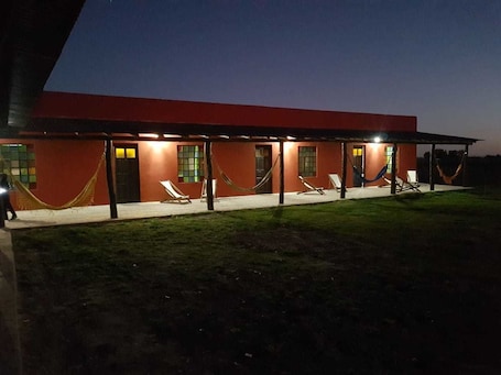 Front of property – evening/night. La Maina Uribe Posada y Cabañas