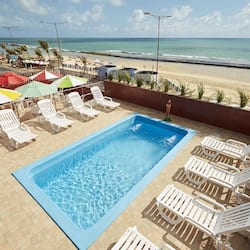 Outdoor pool, open 9:00 AM to 9:00 PM, pool umbrellas, pool loungers