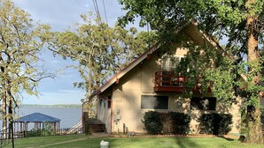 A house with a number 532, a covered patio, and a view of the water. - Waterfront Home! Relax & Enjoy the Serenity of Lake Palestine.  
 (Chandler)