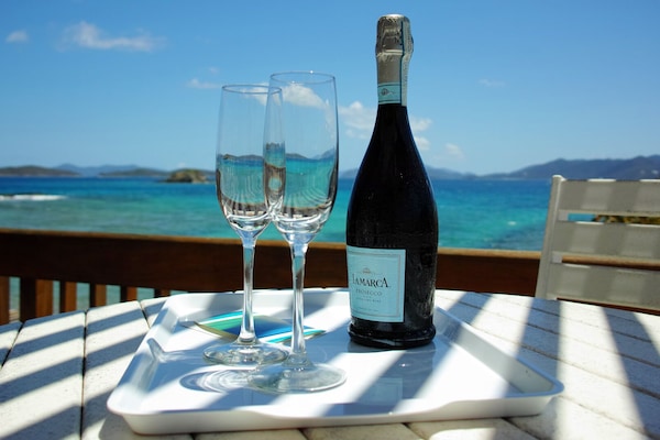 Enjoy your vacation with cold bubbly overlooking the vast of blue!