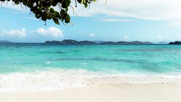 On the beach, sun loungers, beach towels