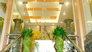 A hotel entrance with a sign reading "NAMISON HOTEL MASSAGE VIP". - Nam Son Hotel (Hanoi)