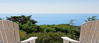 Luxurious, new coastal home w/modern kitchen, sweeping ocean and pastoral views