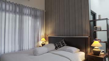 Deluxe Room, 1 King Bed | 1 bedroom, individually decorated, individually furnished, soundproofing