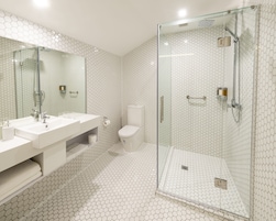 Shower, rainfall showerhead, hair dryer, towels