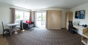 Luxury Apartment, 1 Bedroom | Living room | 50-inch TV with cable channels, Netflix, streaming services - V Motel (Christchurch)