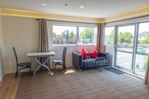 Luxury Apartment, 1 Bedroom | Living area | 50-inch TV with cable channels, Netflix, streaming services