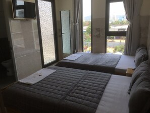 Panoramic Twin Room | Minibar, desk, blackout drapes, iron/ironing board