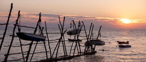 Stroll along the serene coastal dock, surrounded by the tranquil sea.