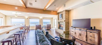 Dramatic oceanfront views. Open high ceilings. Huge deck & walls of windows!