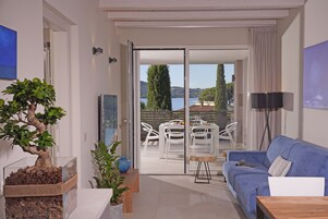 Executive Apartment, 2 Bedrooms, Balcony, Lake View | Living area | 50-inch Smart TV with satellite channels, TV