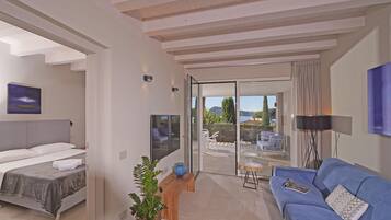 Appartamento Executive, 2 camere da letto, balcone, vista lago | Area soggiorno | Smart TV 50 pollici con canali satellitari, TV