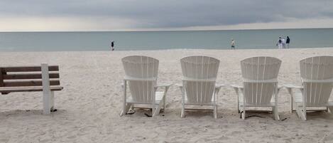 On the beach, sun-loungers