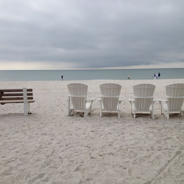 On the beach, sun-loungers