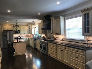 Microwave, dishwasher, coffee/tea maker, cookware/dishes/utensils