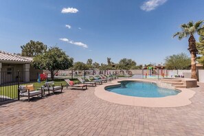 A heated pool, pool loungers