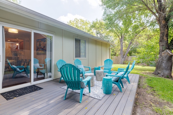 Backyard has patio and trees