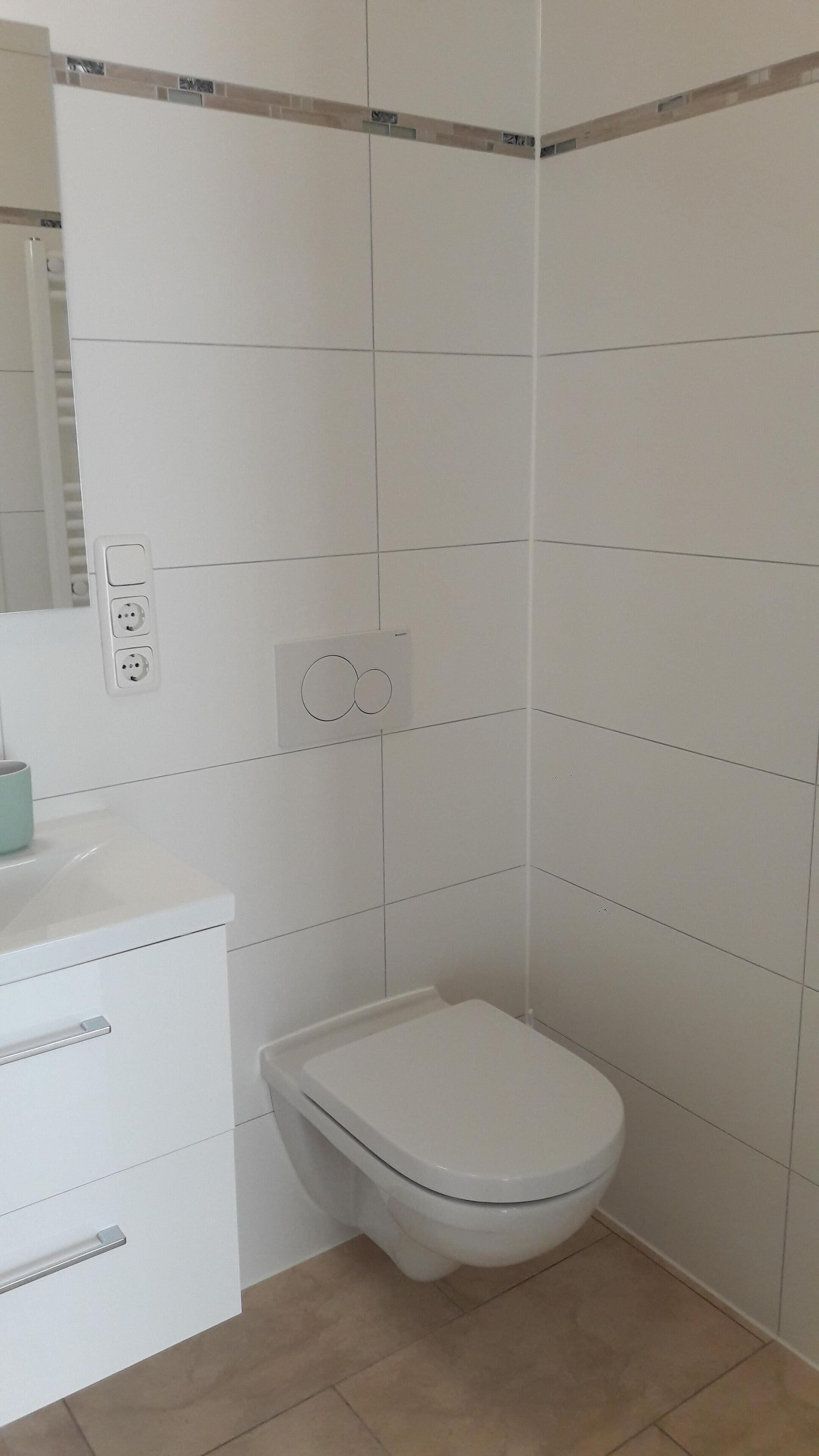 Dusj, hårføner, håndklær og såpe