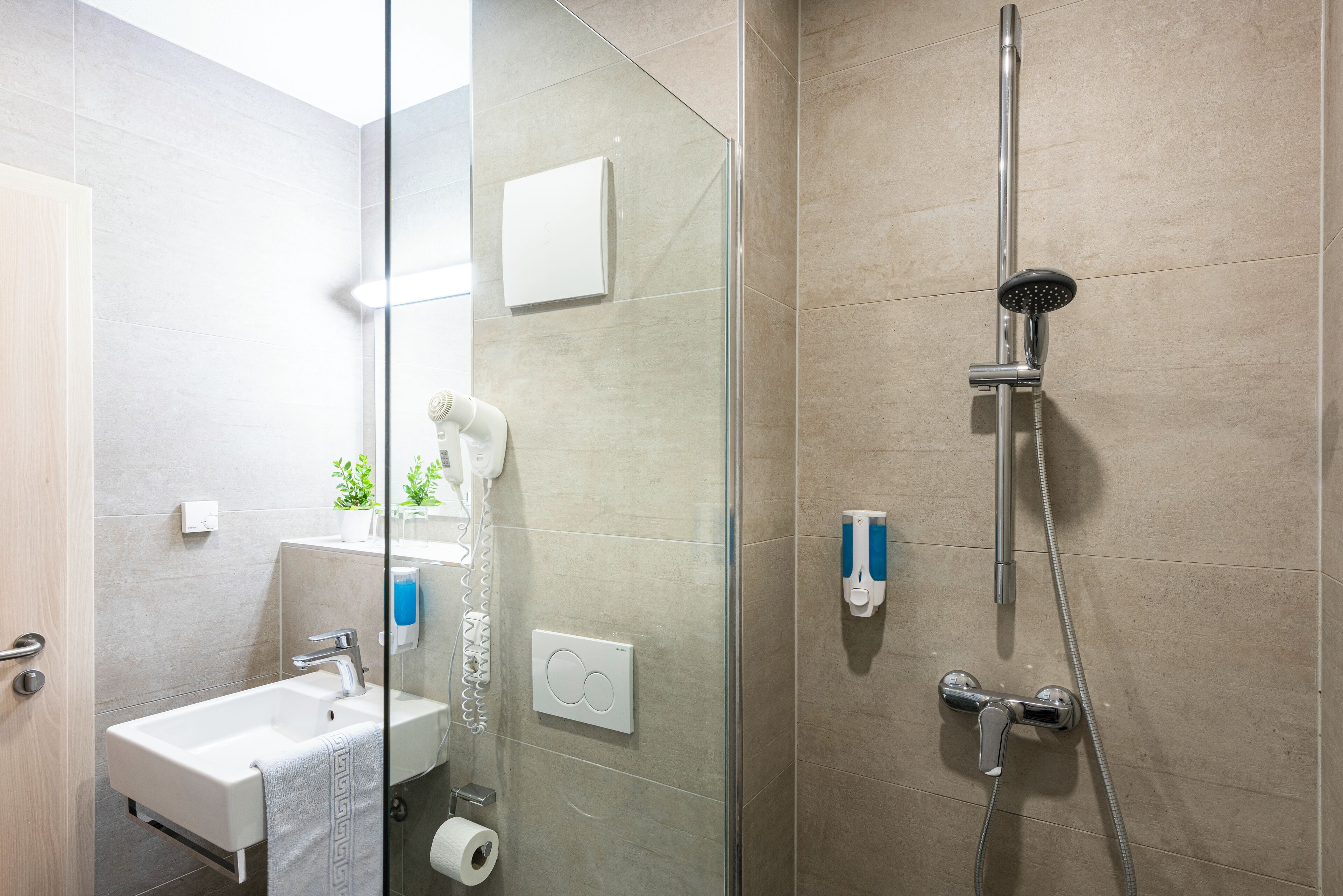 shower, hair dryer, towels, soap