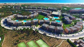 7 outdoor pools, pool umbrellas, pool loungers