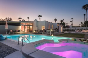 A modern house with a swimming pool, outdoor seating, and a hot tub. - PS Autorama: Heart-Racing Mid-Century Charm and Modern Comfort (Palm Springs)