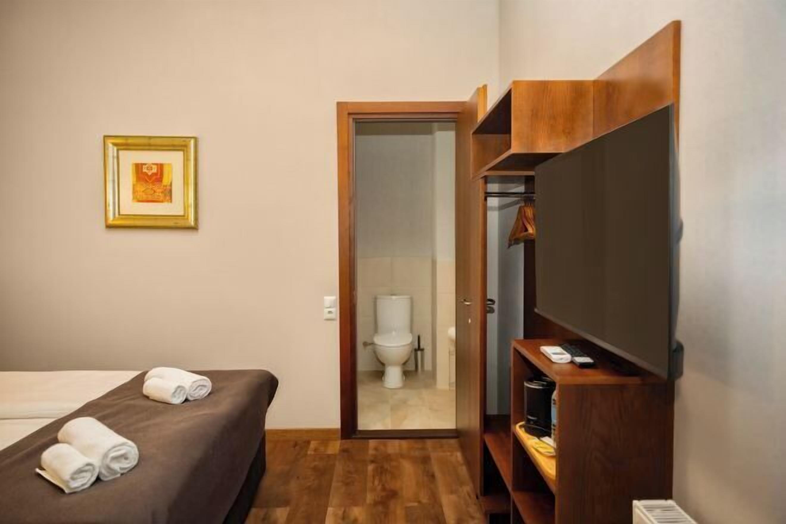 Premium bedding, desk, laptop workspace, soundproofing