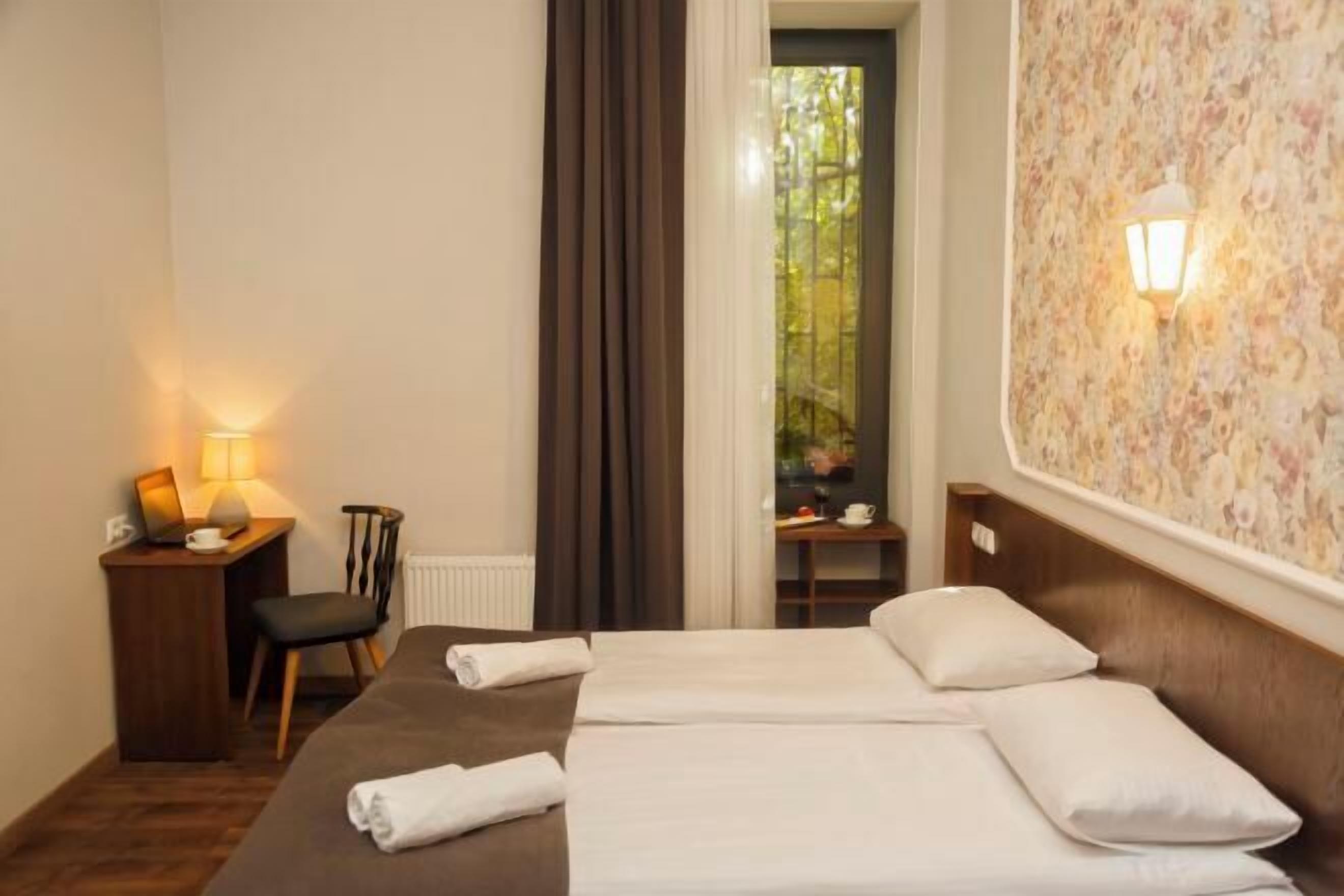 Premium bedding, desk, laptop workspace, soundproofing