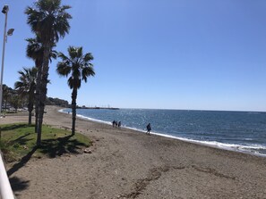 On the beach, sun-loungers